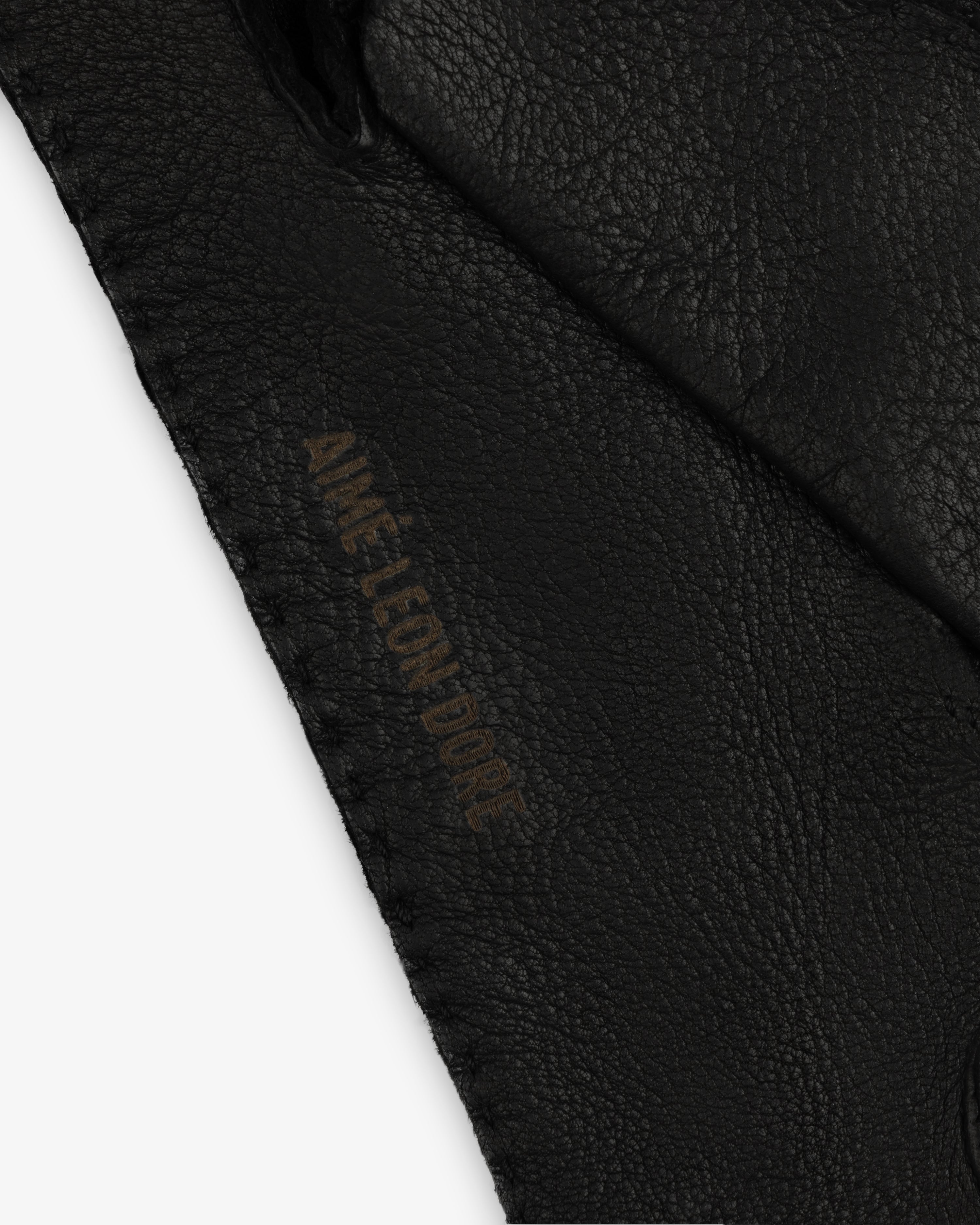 Black Henry Gloves leather glove with an embossed logo along the stitched edge.