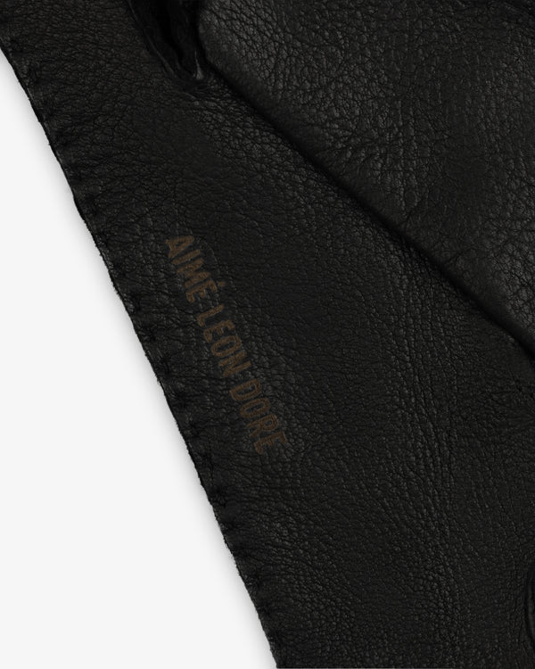 Black Henry Gloves leather glove with an embossed logo along the stitched edge.