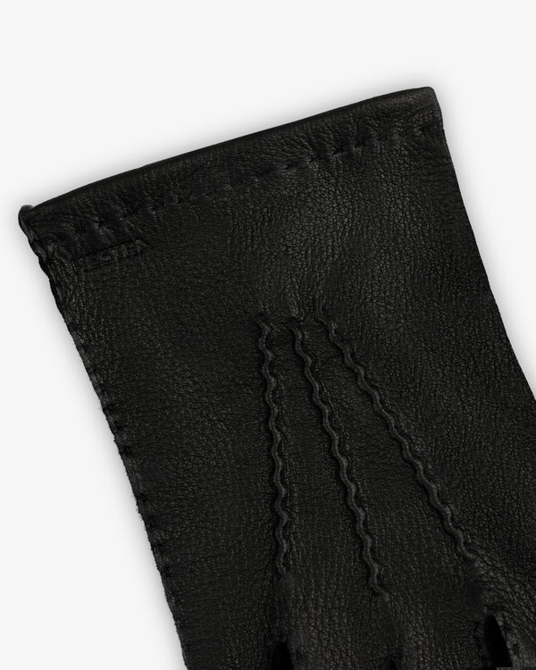 Close-up of a black leather Henry Glove with three rows of decorative stitching on the back.