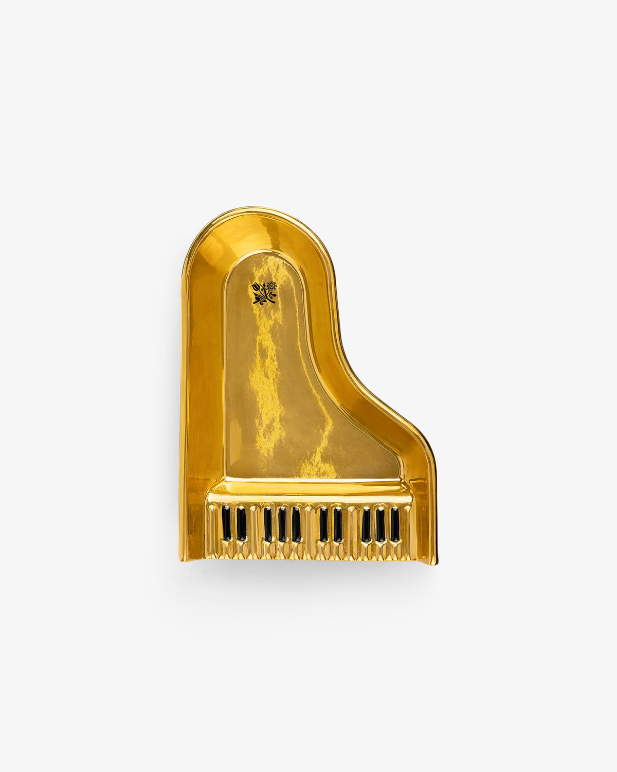 The Piano Ashtray features a shiny gold finish and a grand piano shape with black and white keys at the bottom.