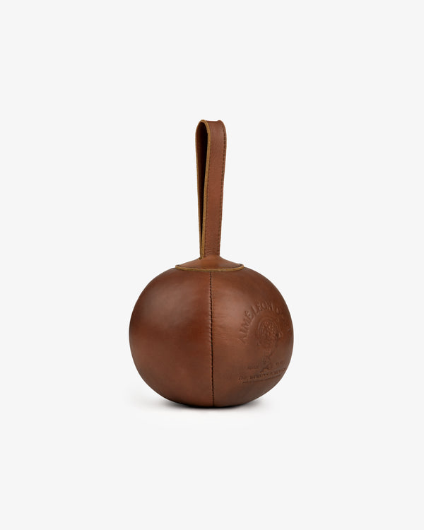 Atlas Vintage Leather 10 Lb Kettle Bell: a spherical brown leather kettlebell with a strap handle and embossed branding.