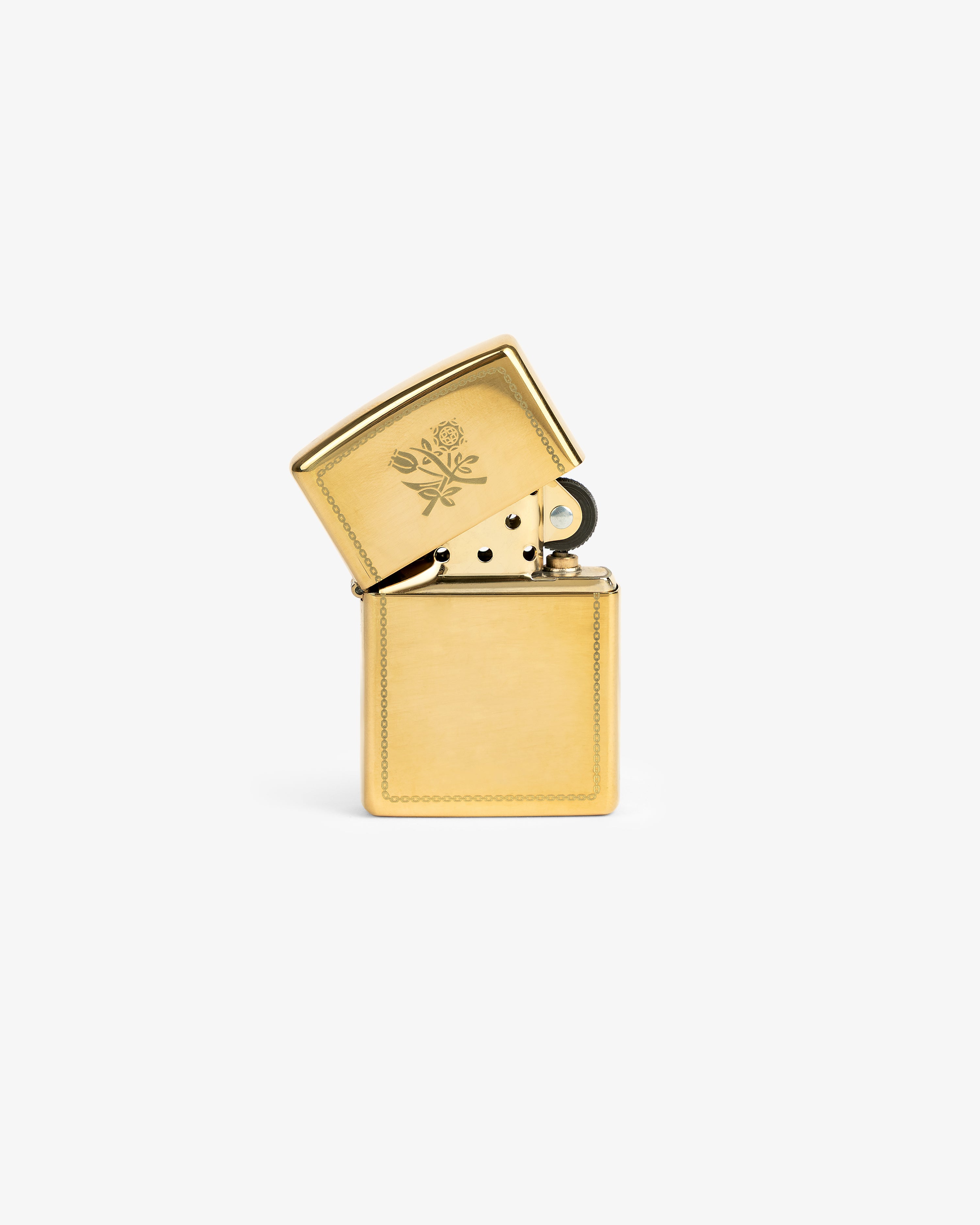 A Graphic Zippo Lighter with an open lid, engraved with florals, is shown against a white background.