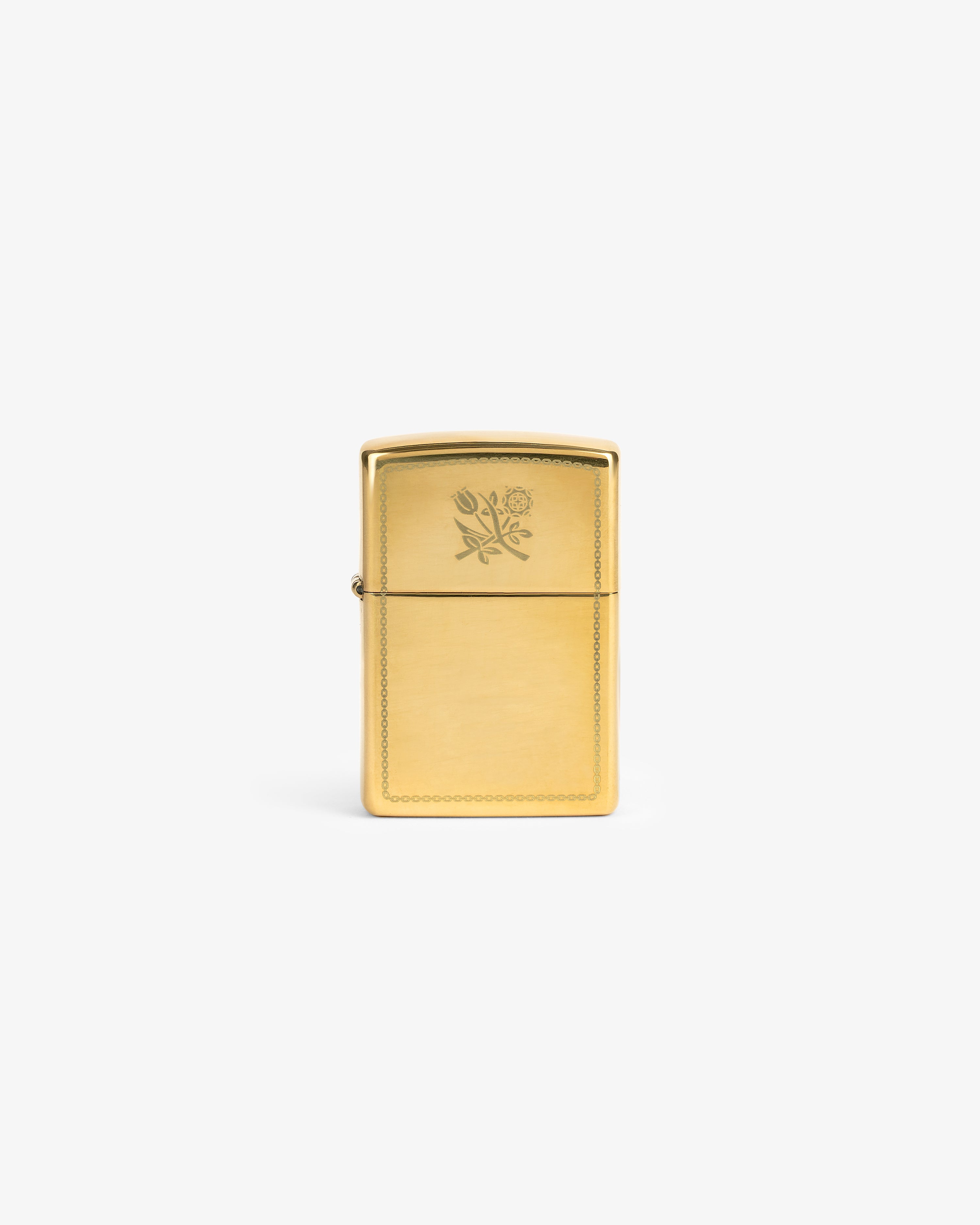 Graphic Zippo Lighter with engraved rose and tulip design, displayed upright on a plain white background.