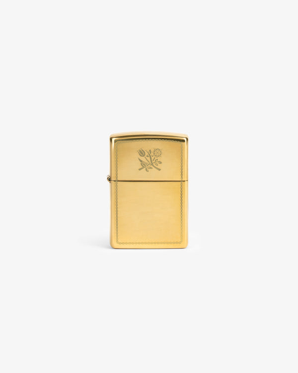 Graphic Zippo Lighter with engraved rose and tulip design, displayed upright on a plain white background.