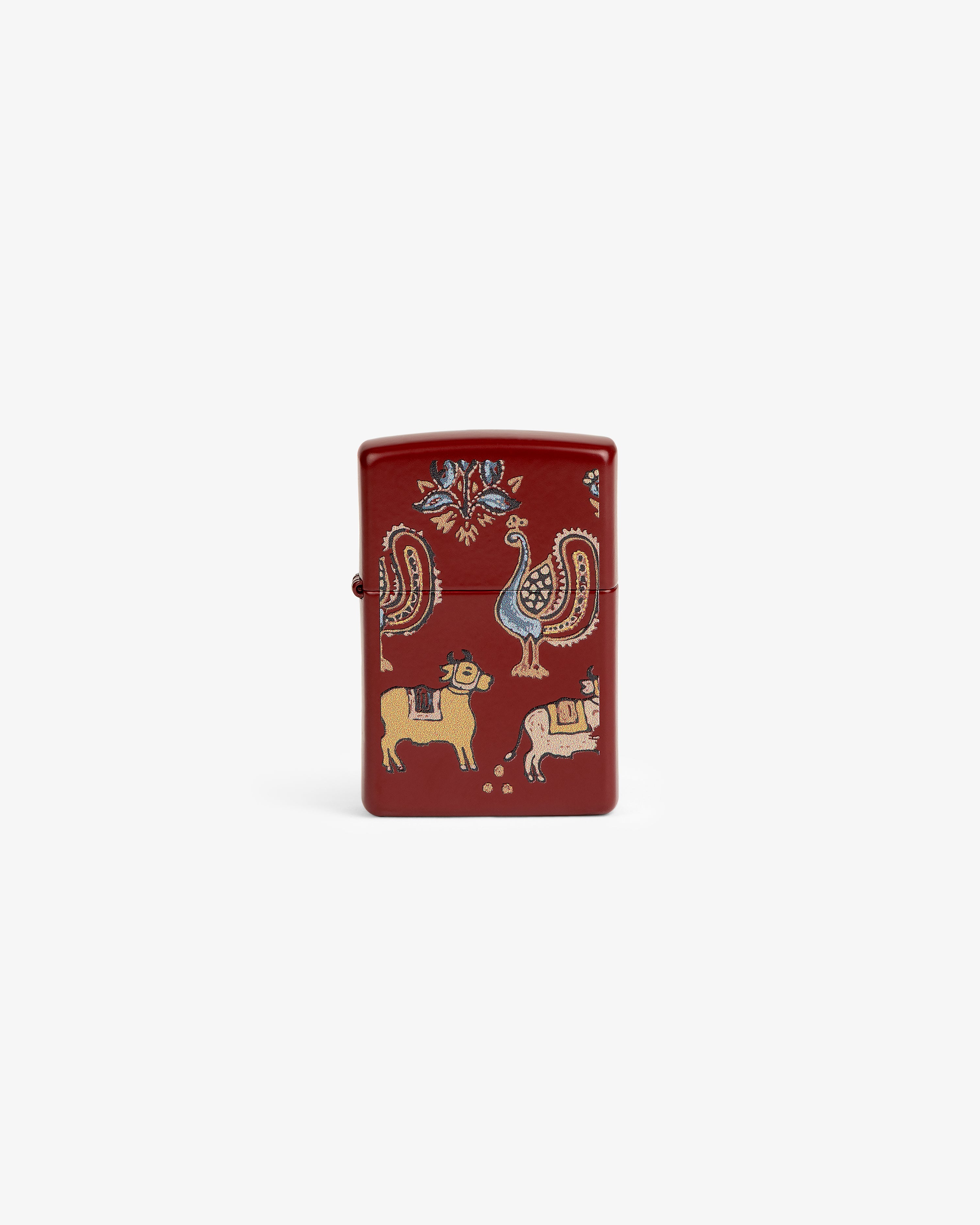 Red Graphic Zippo Lighter with folk art animals and floral designs in yellow, blue, and white on the front.