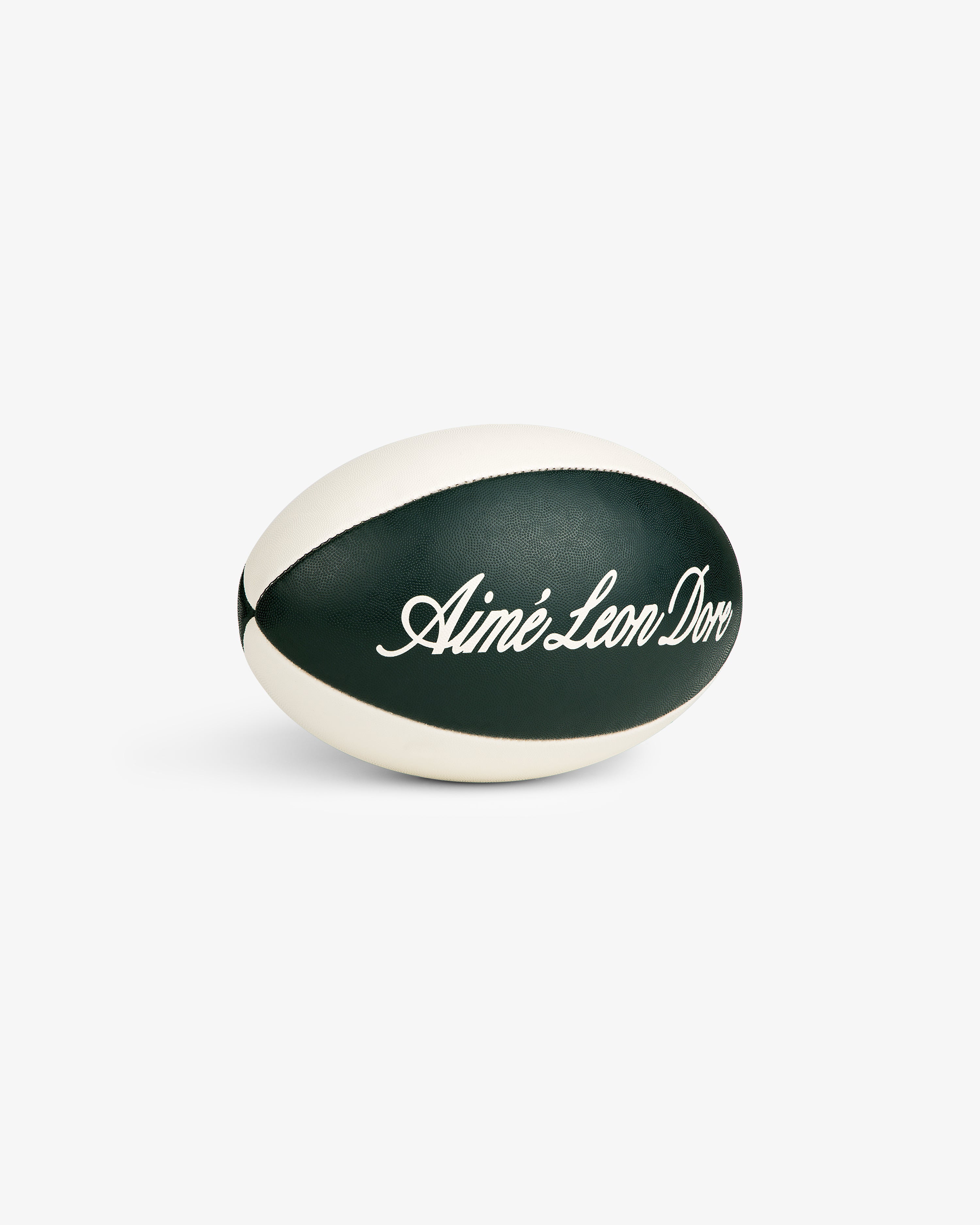 Script Rugby Ball in black and white with cursive Aimé Leon Dore text, displayed on a white background.