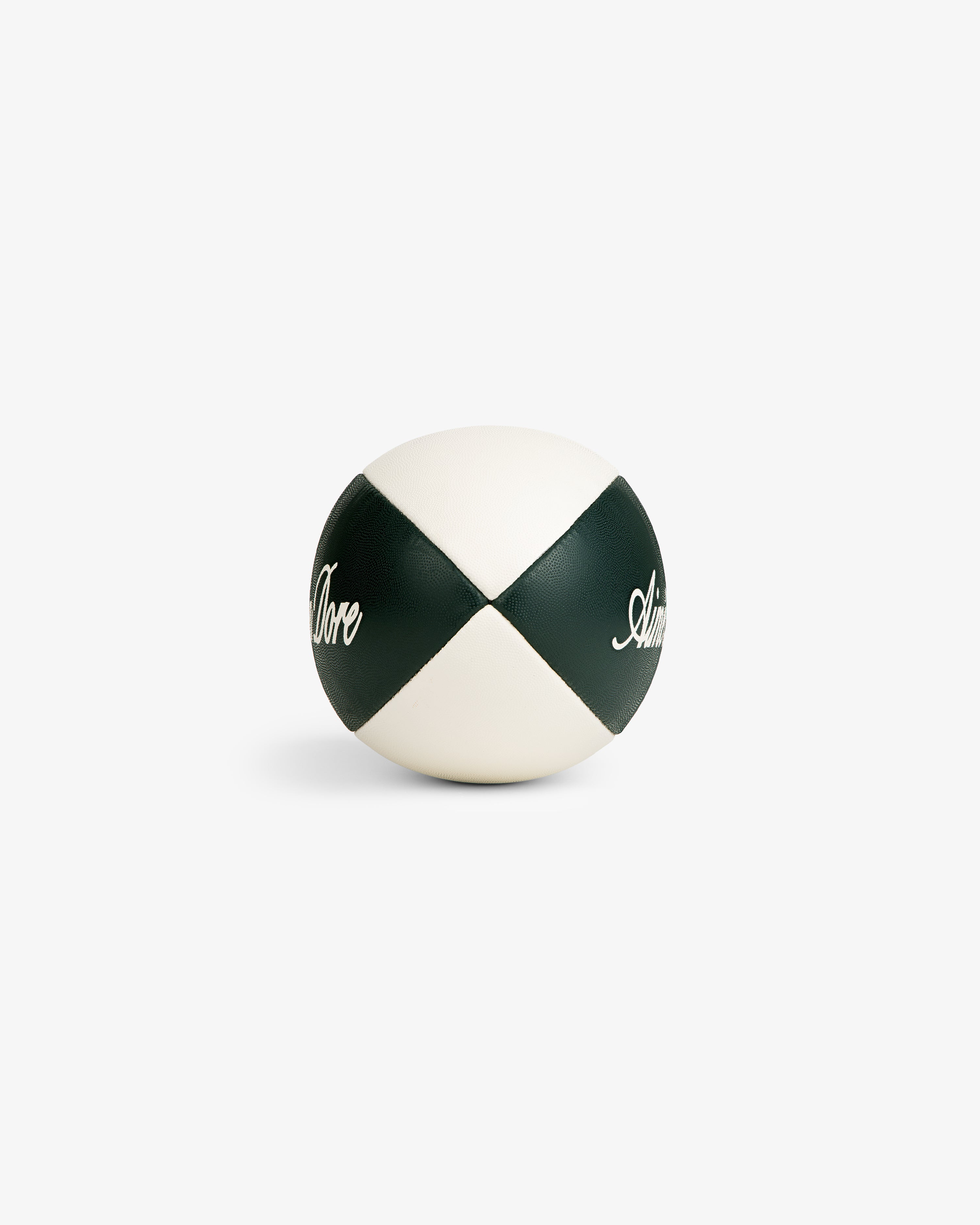 A white and dark green Script Rugby Ball with “Adore” on the panels, shown on a plain white background.