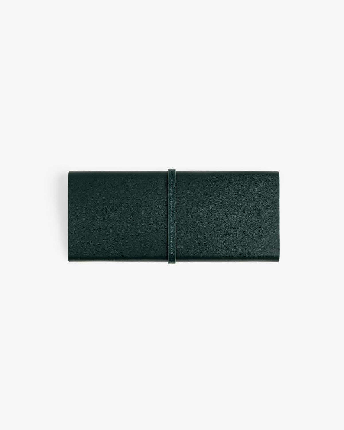 A closed Brass Measurement Kit with a wrap-around strap in dark green leather, on a white background.