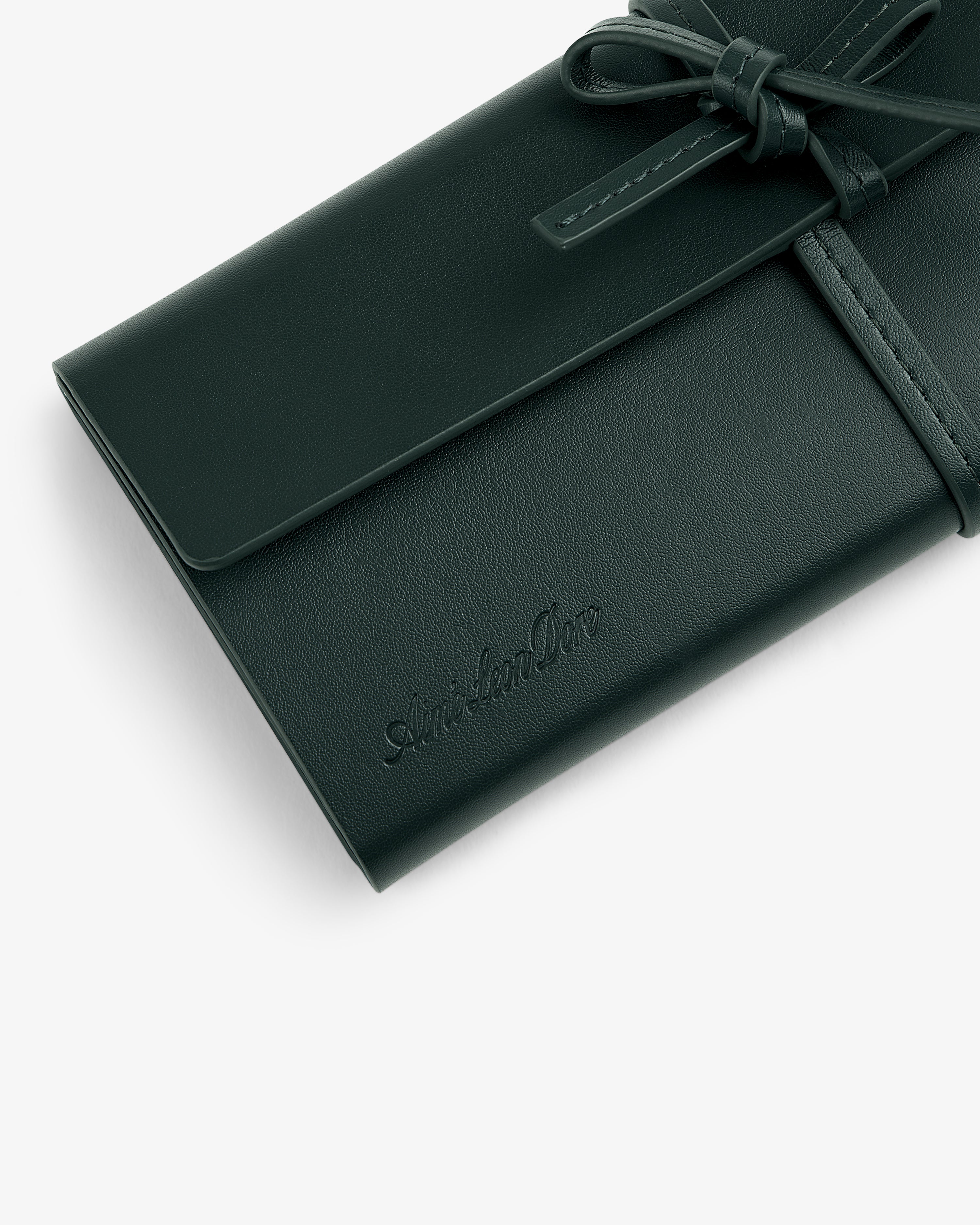 Brass Measurement Kit in a dark green leather pouch with tie closure and embossed logo, shown on white background.