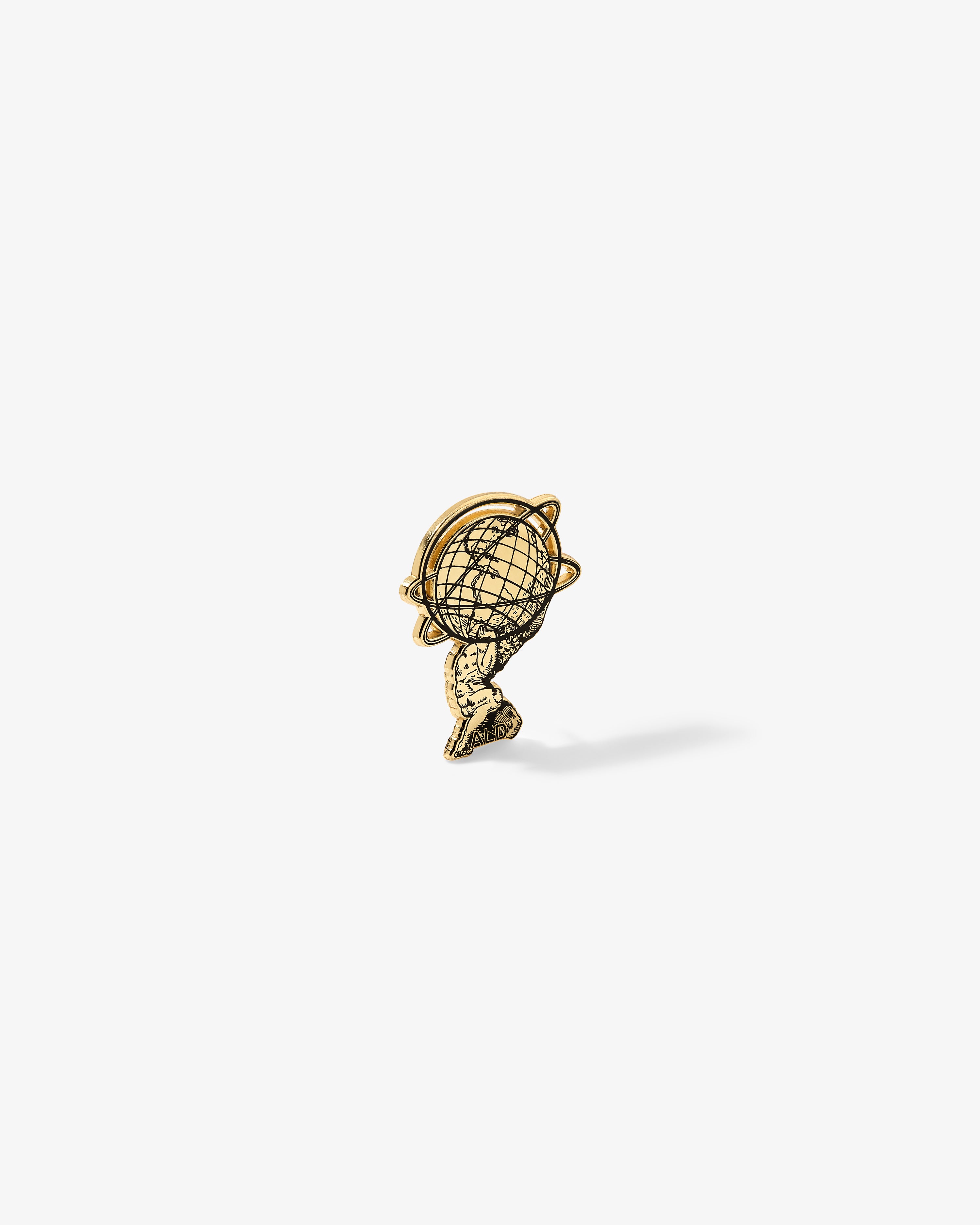 Gold Graphic Pin featuring Atlas holding up a globe, displayed on a plain white background.