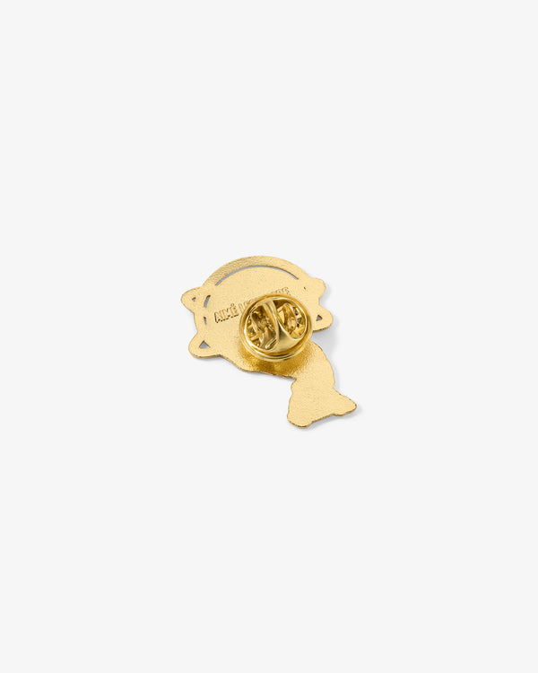 Graphic Pin with a starburst shape and round clasp, shown on a white background.