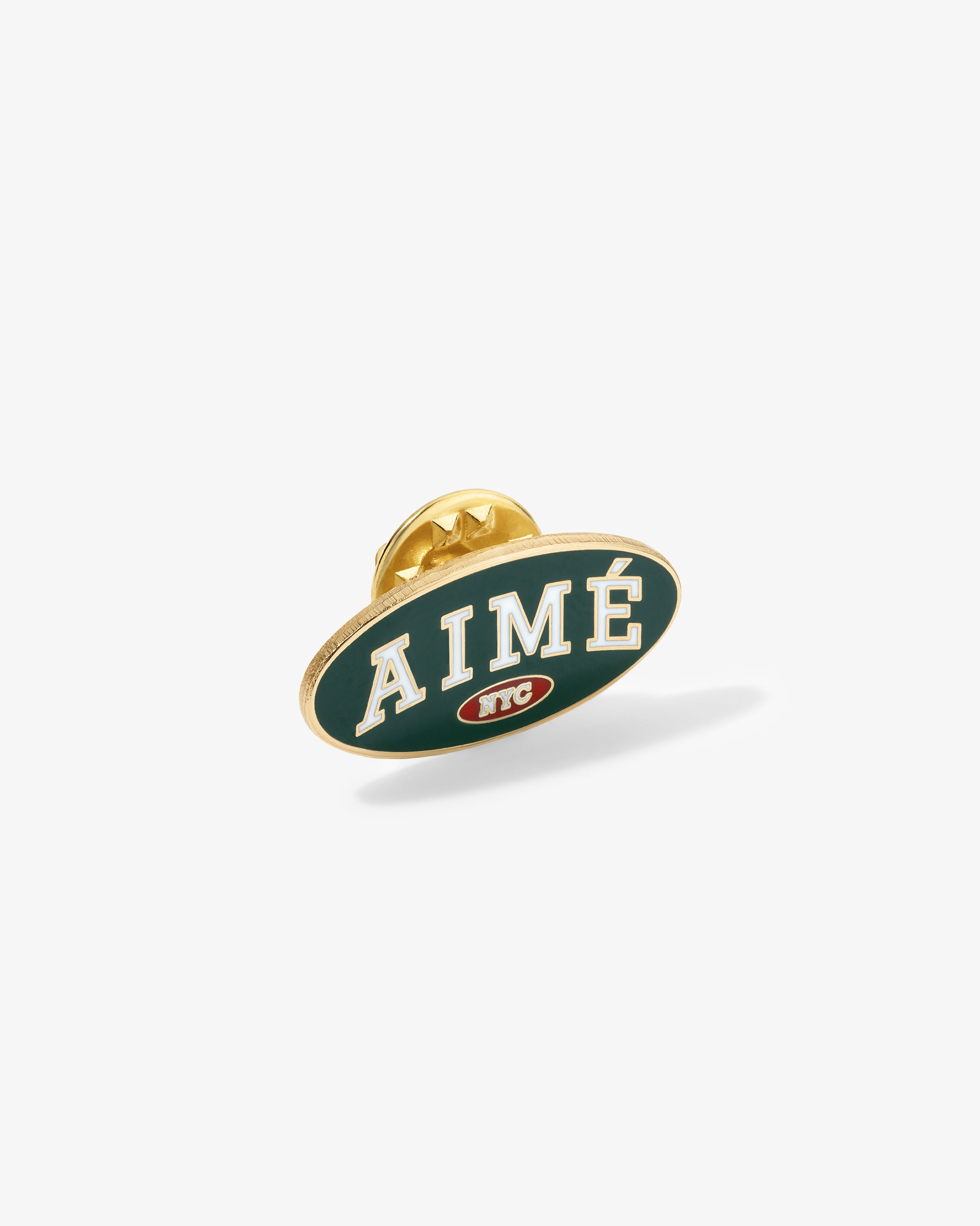 Graphic Pin with white ‘AIMÉ’ on green, gold border, and small NYC logo below.