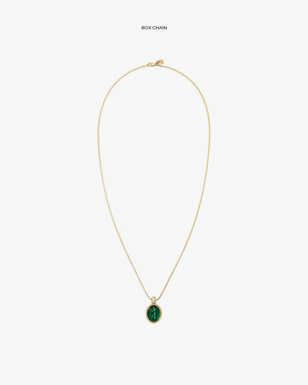A 14Kt Gold Euterpe Relief Pendant on a gold box chain featuring an oval pendant with a green carved figure.