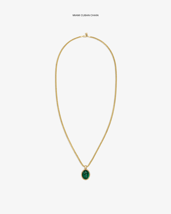 14Kt Gold Euterpe Relief Pendant featuring a gold Cuban chain and an oval pendant with a green carved relief.