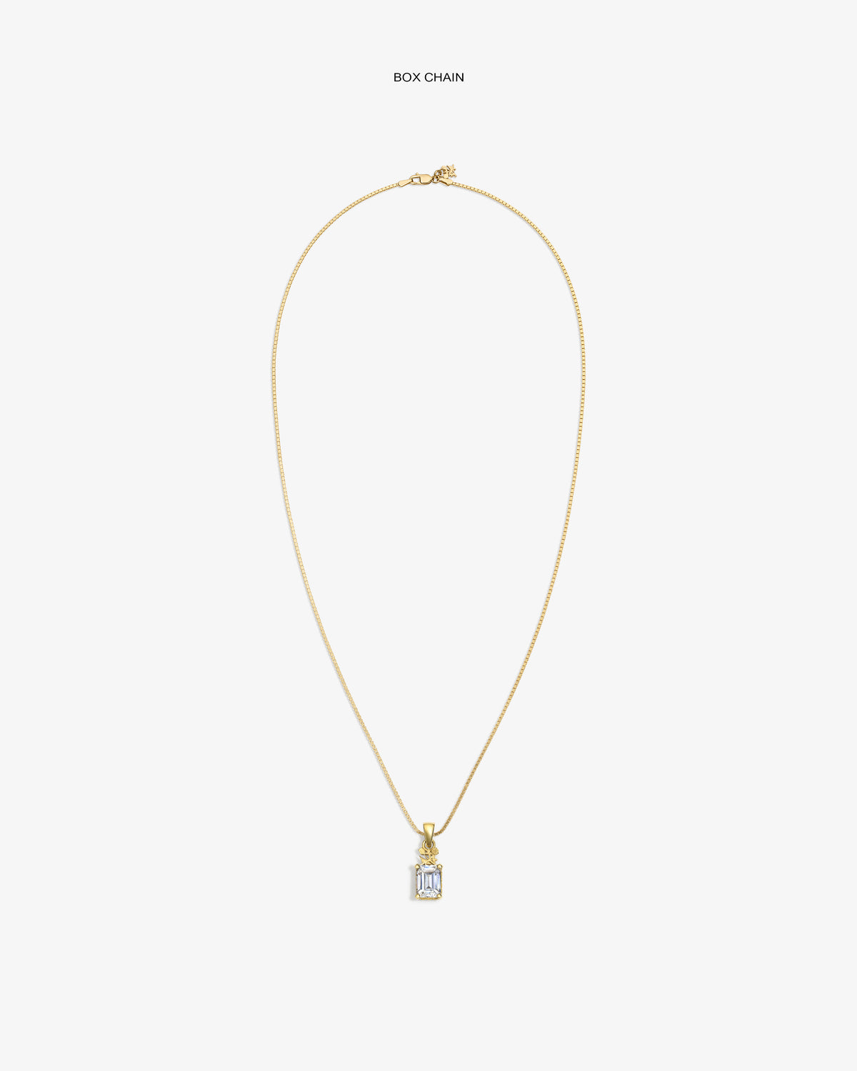 14Kt Gold Crest Gemstone Pendant on a box chain, showcased against a plain white background.
