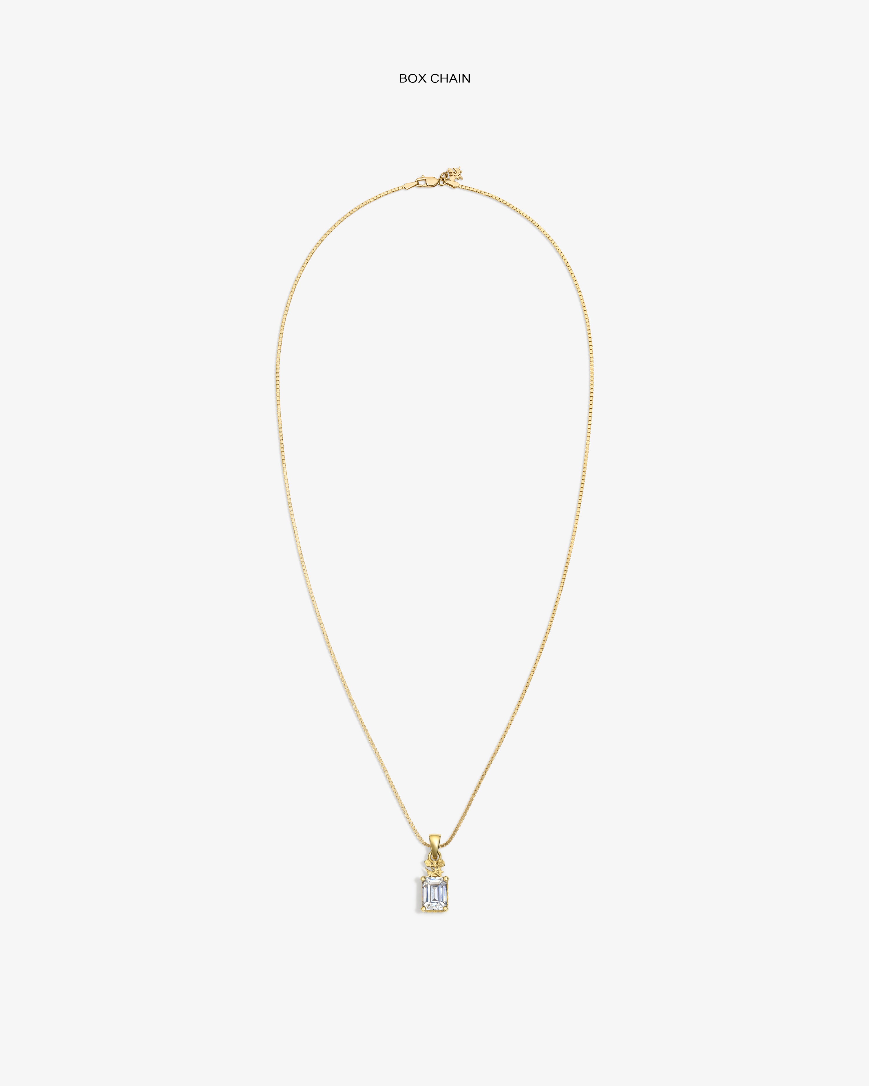 14Kt Gold Crest Gemstone Pendant on a box chain, showcased against a plain white background.