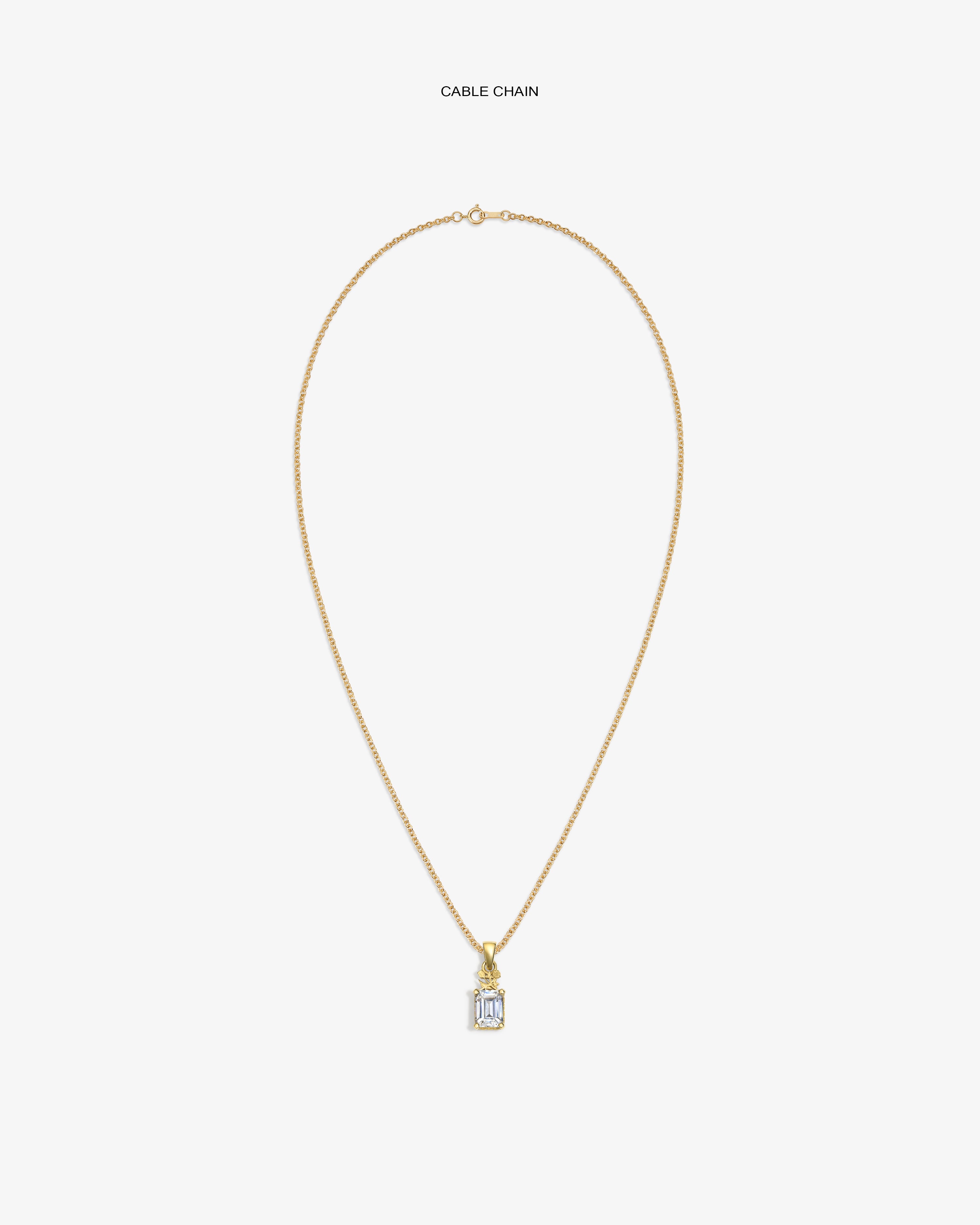 14Kt Gold Crest Gemstone Pendant on a cable chain, featuring a rectangular clear stone, shown on a white background.