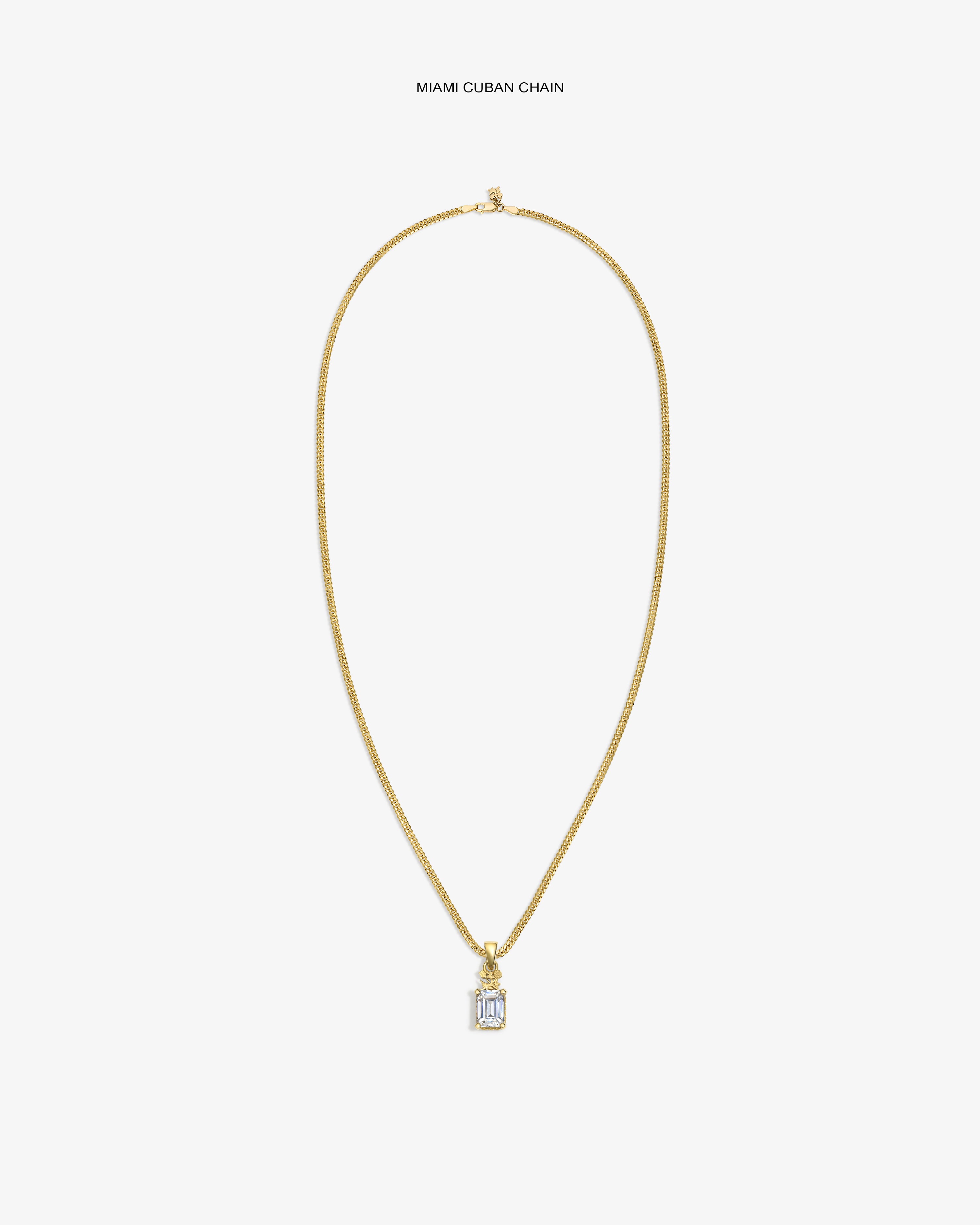 14Kt Gold Crest Gemstone Pendant Miami Cuban chain necklace on a plain white background.