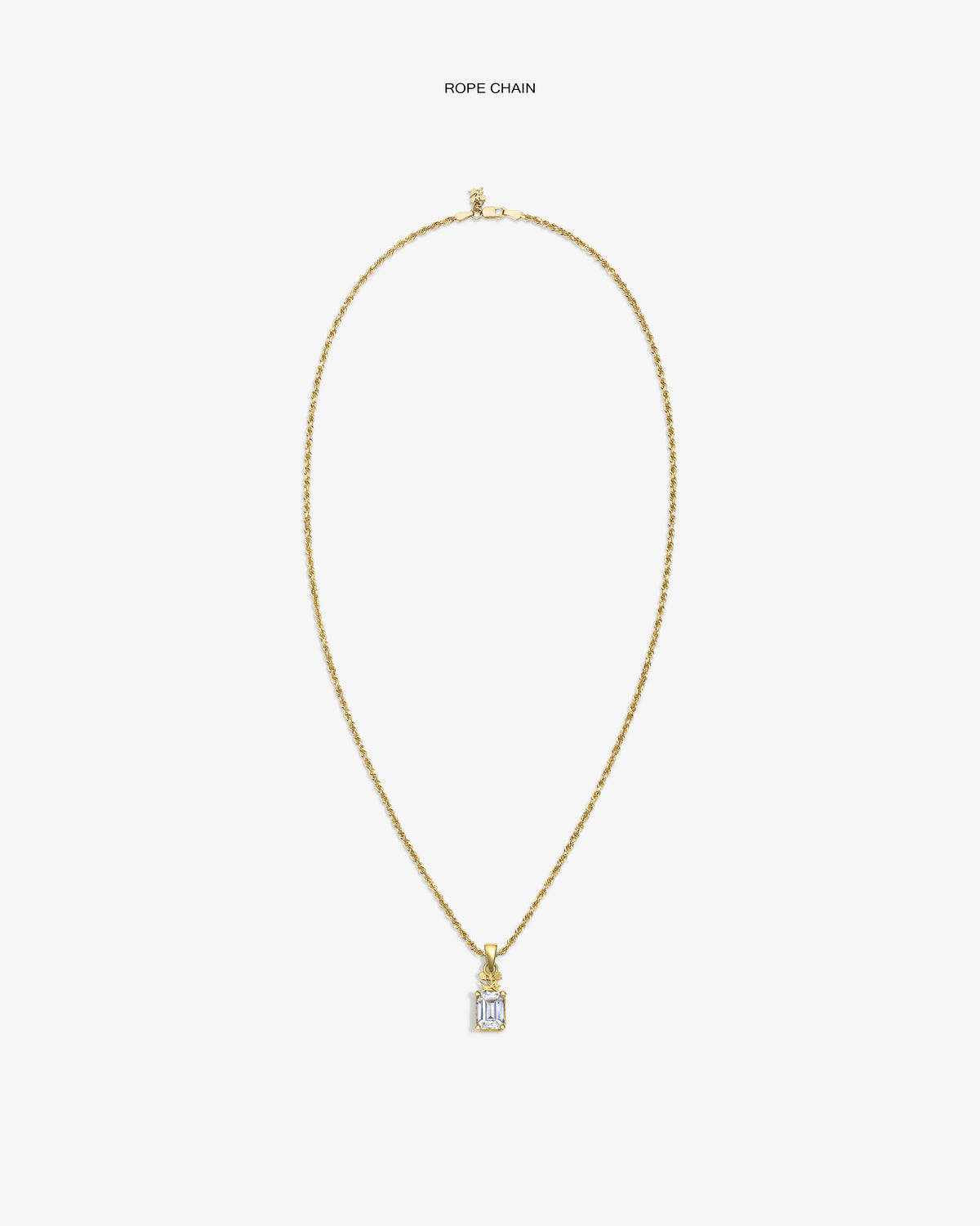 14Kt Gold Crest Gemstone Pendant on rope chain, rectangular with clear gem, shown against a white background.