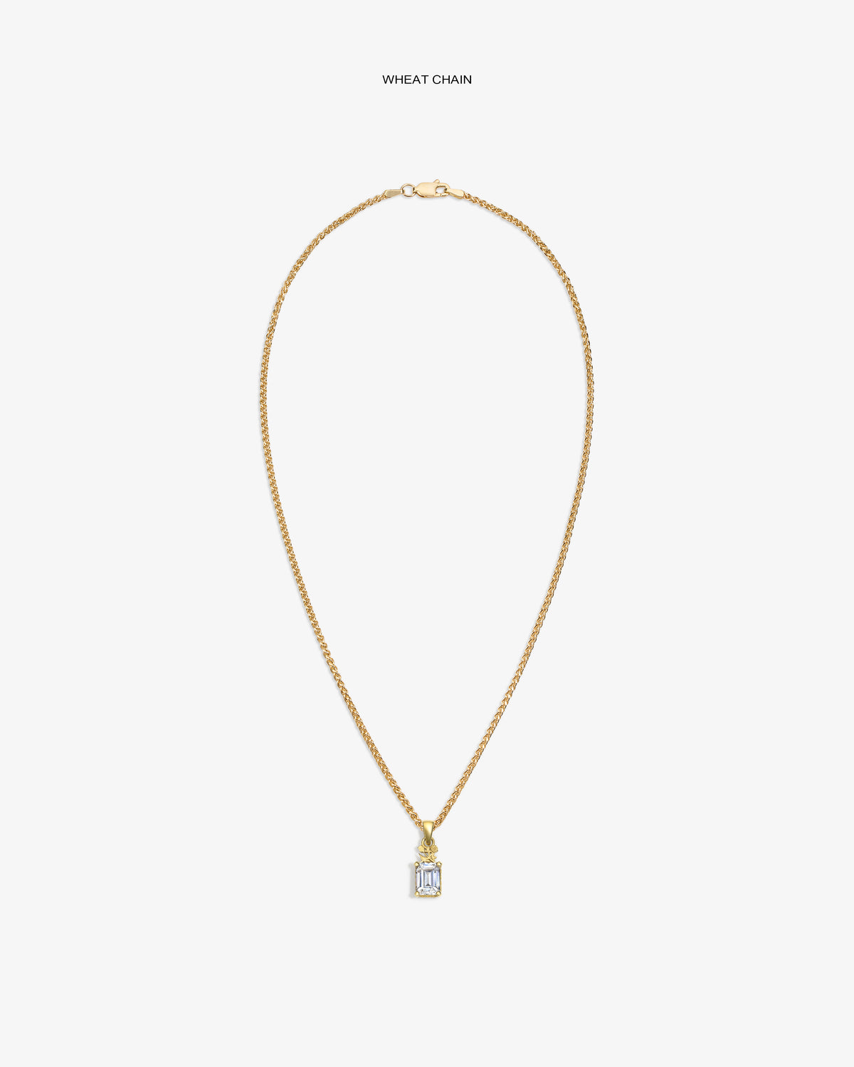 14Kt Gold Crest Gemstone Pendant on a wheat chain, shown with a clear gemstone and rectangular design on white background.