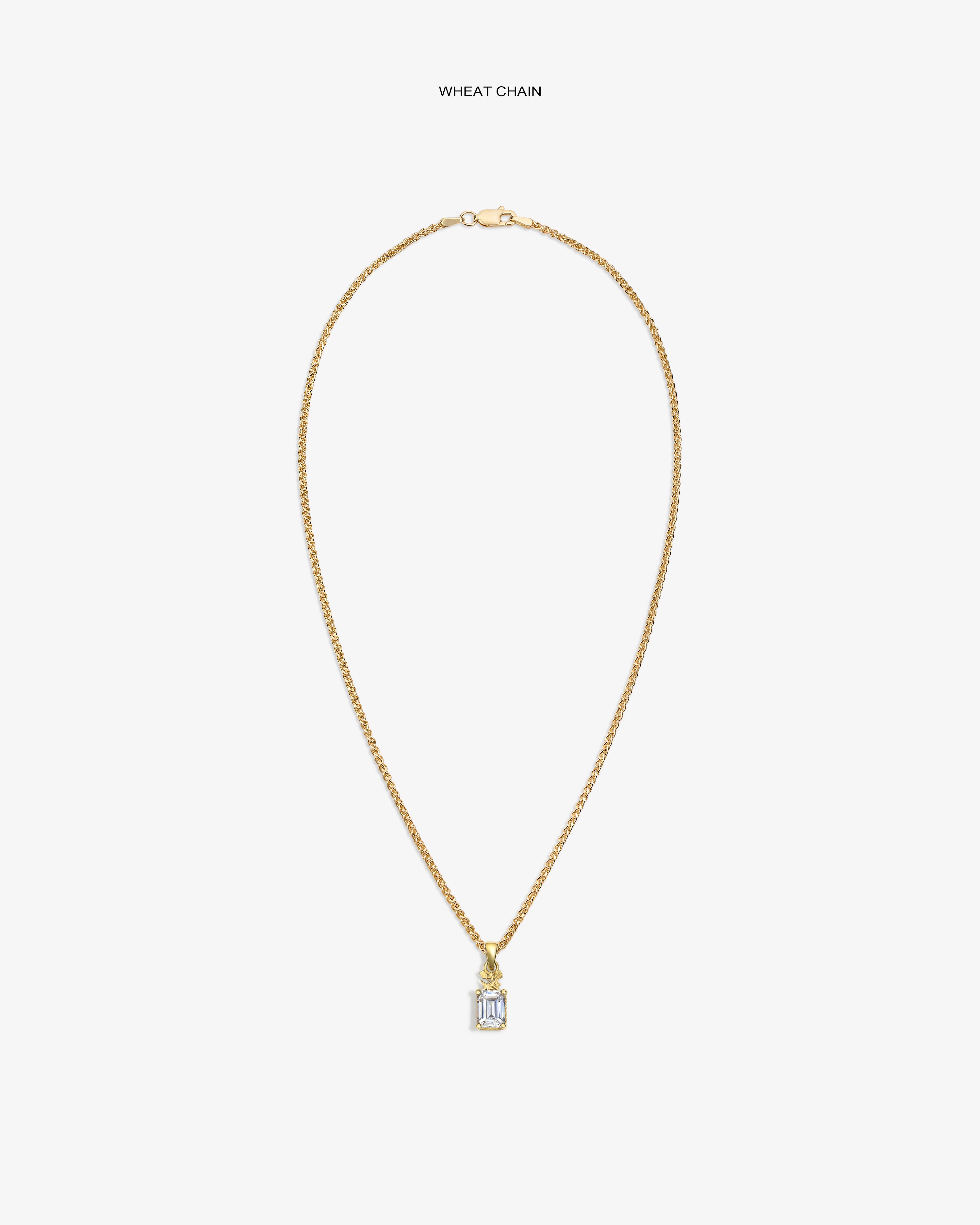 14Kt Gold Crest Gemstone Pendant on a wheat chain, shown with a clear gemstone and rectangular design on white background.