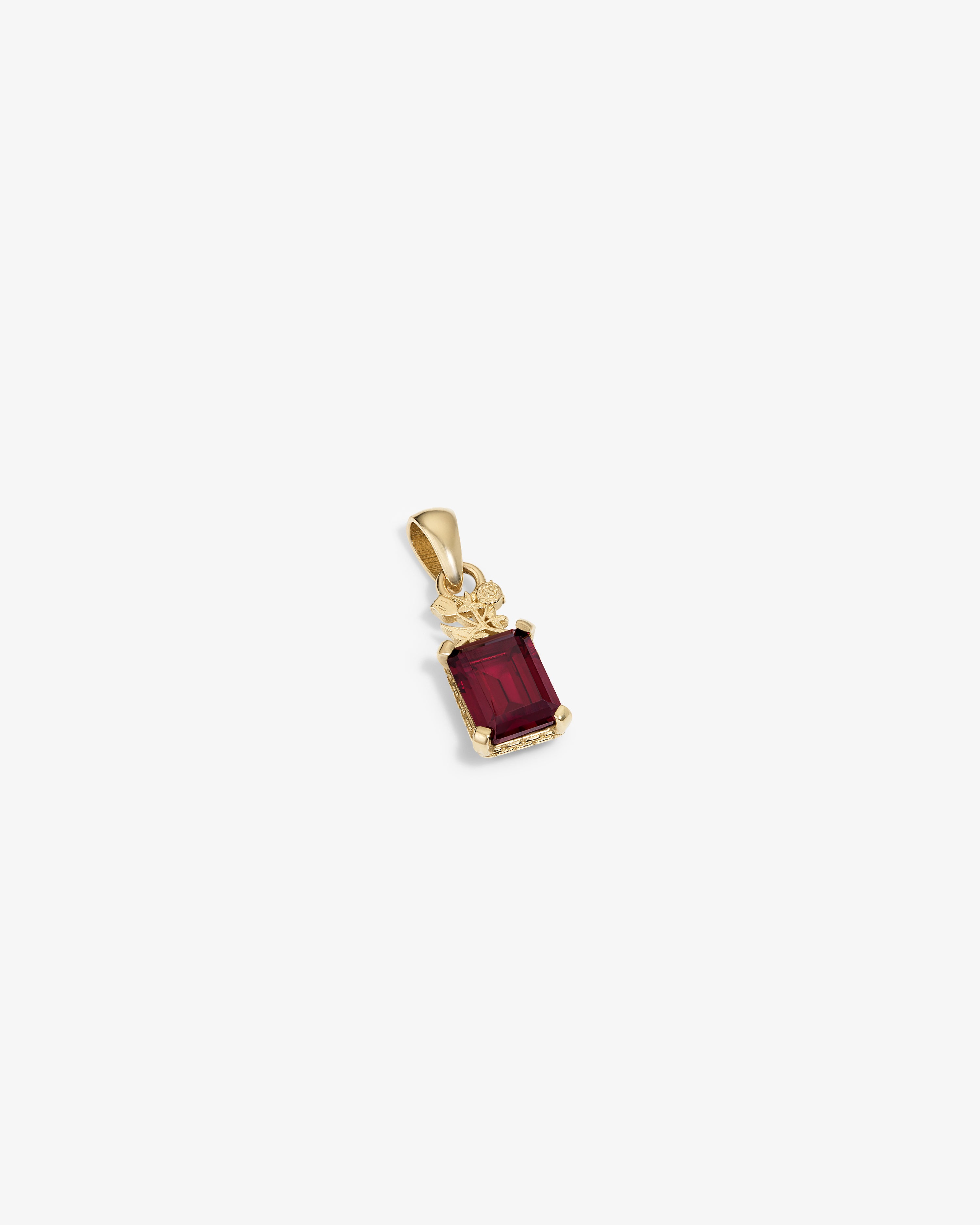 14Kt Gold Crest Pendant featuring a rectangular red gemstone and decorative top detail, on a white background.