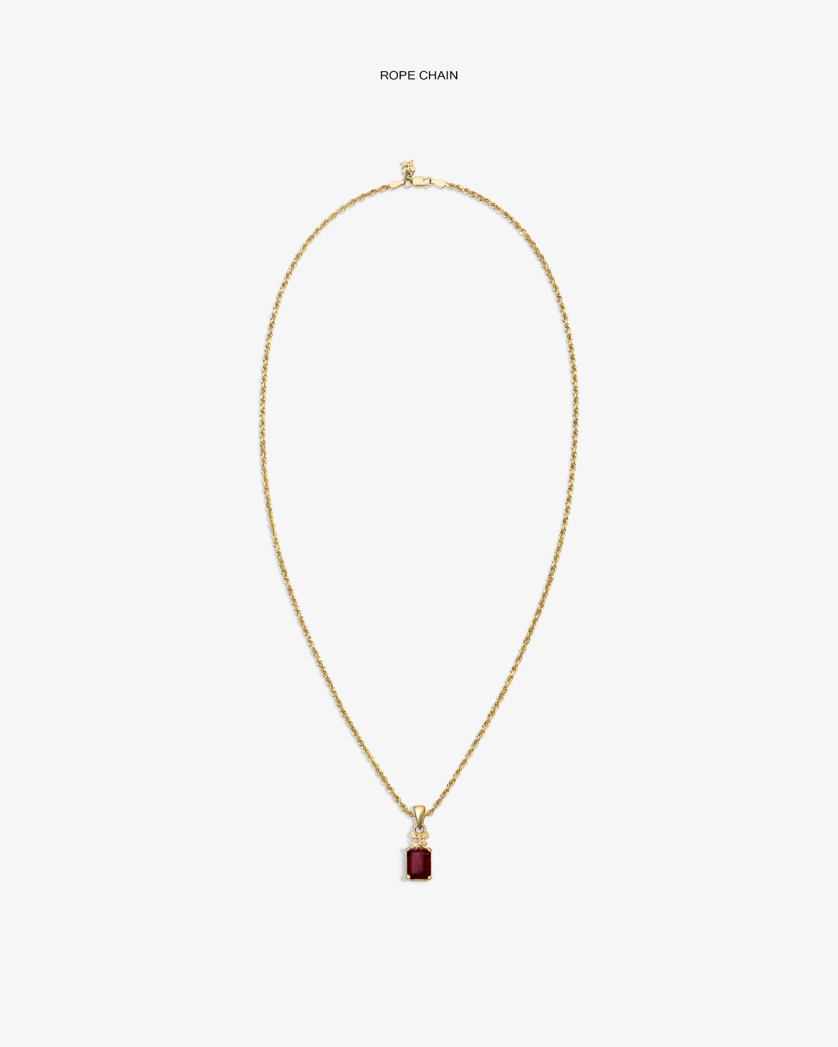 14Kt Gold Crest Gemstone Pendant with a red stone, shown on a plain white background.
