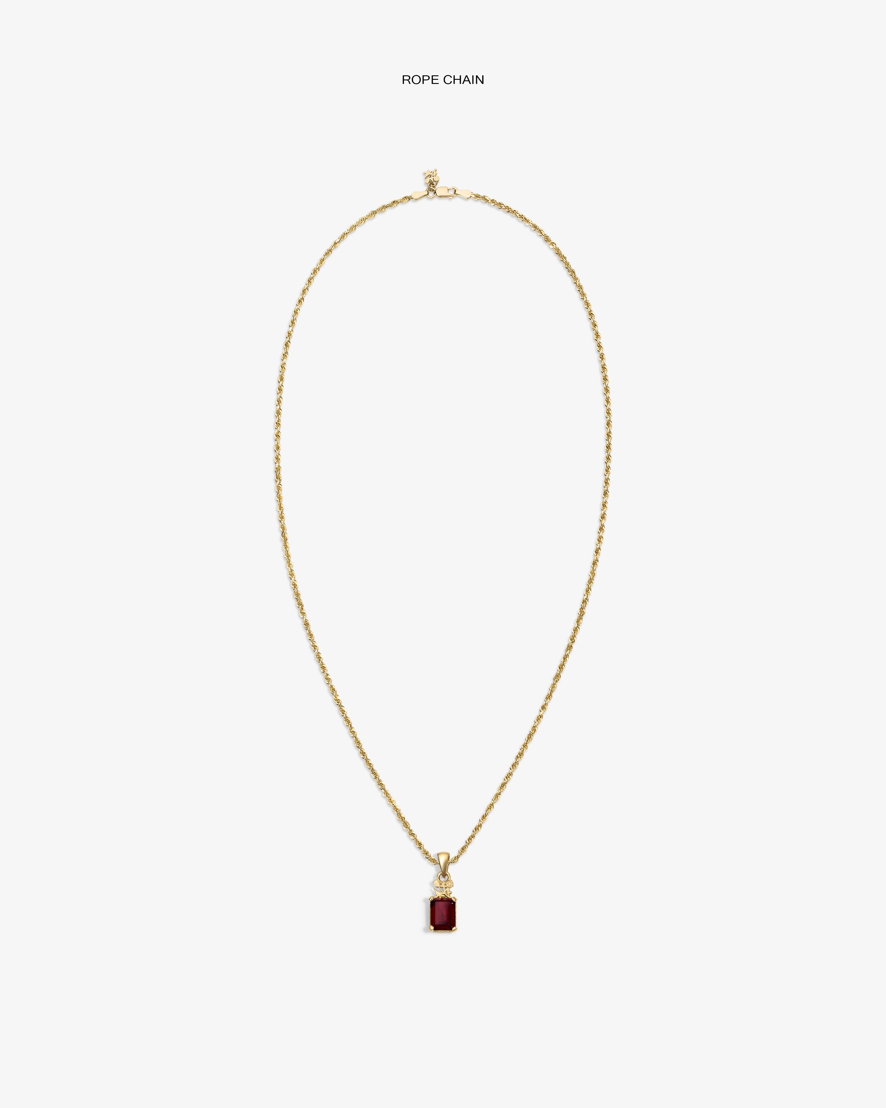 14Kt Gold Crest Gemstone Pendant with a red stone, shown on a plain white background.