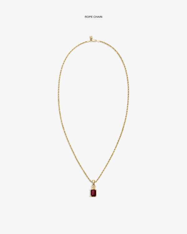 14Kt Gold Crest Gemstone Pendant with a red stone, shown on a plain white background.