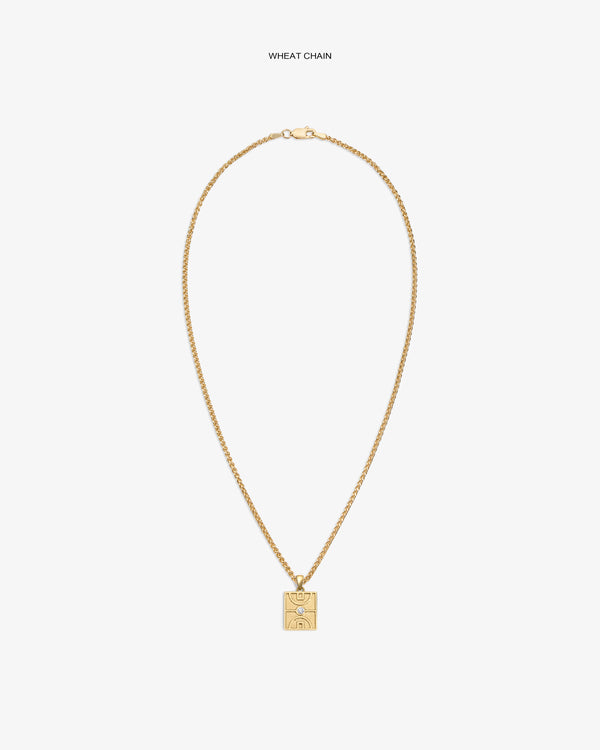14Kt Gold Diamond Court Pendant on a wheat chain, featuring an engraved abstract face, set against a white background.