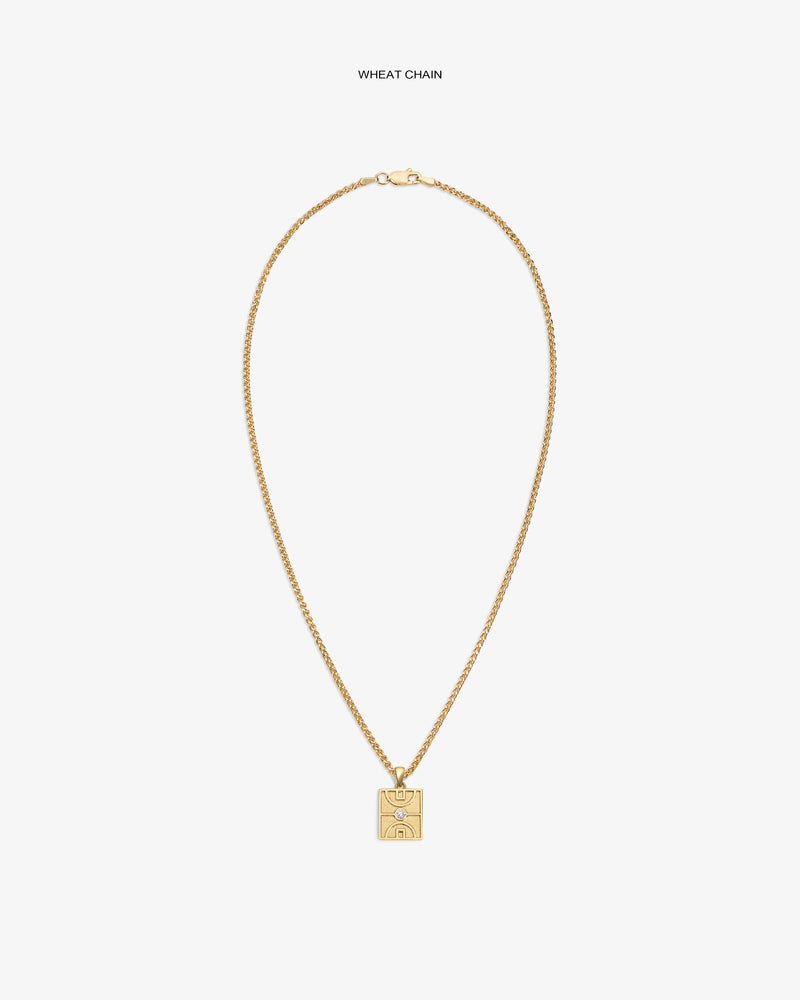 14Kt Gold Diamond Court Pendant on a wheat chain, featuring an engraved abstract face, set against a white background.