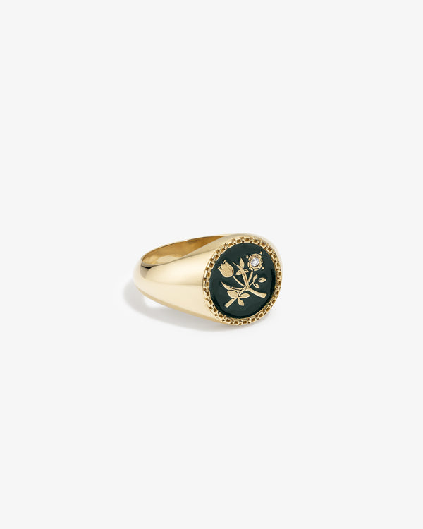 14Kt Gold Stained Glass Crest Ring featuring a dark circular inlay, engraved flower design, and a small embedded diamond.