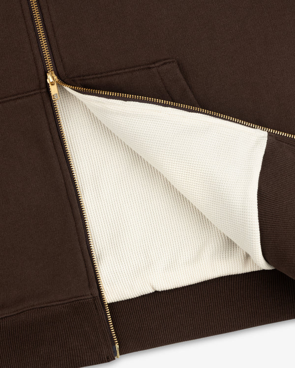 Unisphere Waffle Lined Full-Zip Hoodie in brown, partially unzipped to show the textured white lining and gold zipper.
