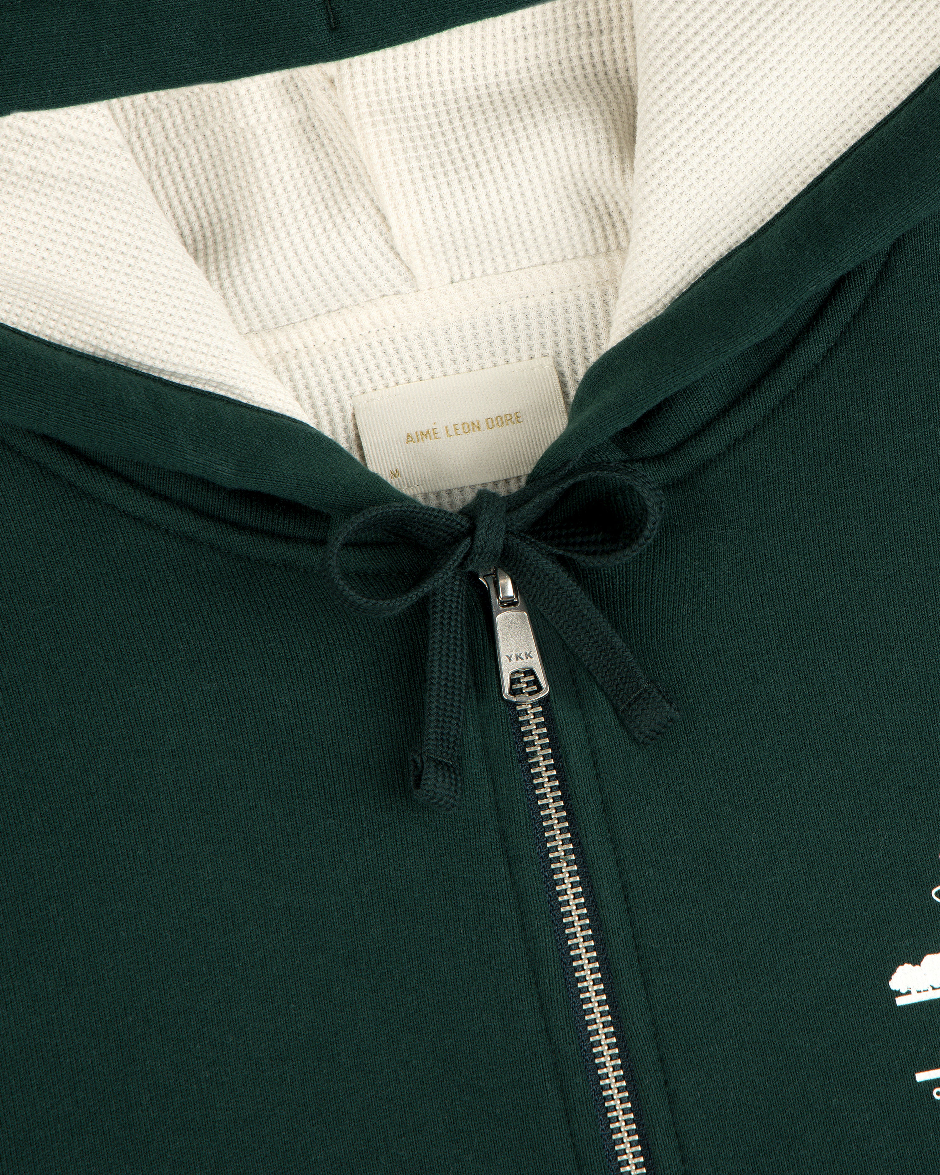 Unisphere Waffle Lined Full-Zip Hoodie in dark green with metal zipper, drawstring, and inside Aimé Leon Dore label.