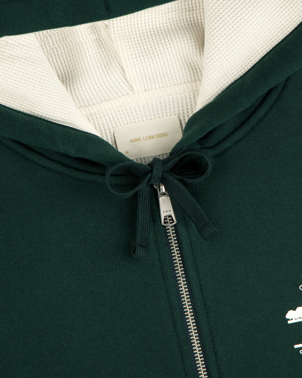 Unisphere Waffle Lined Full-Zip Hoodie in dark green with metal zipper, drawstring, and inside Aimé Leon Dore label.