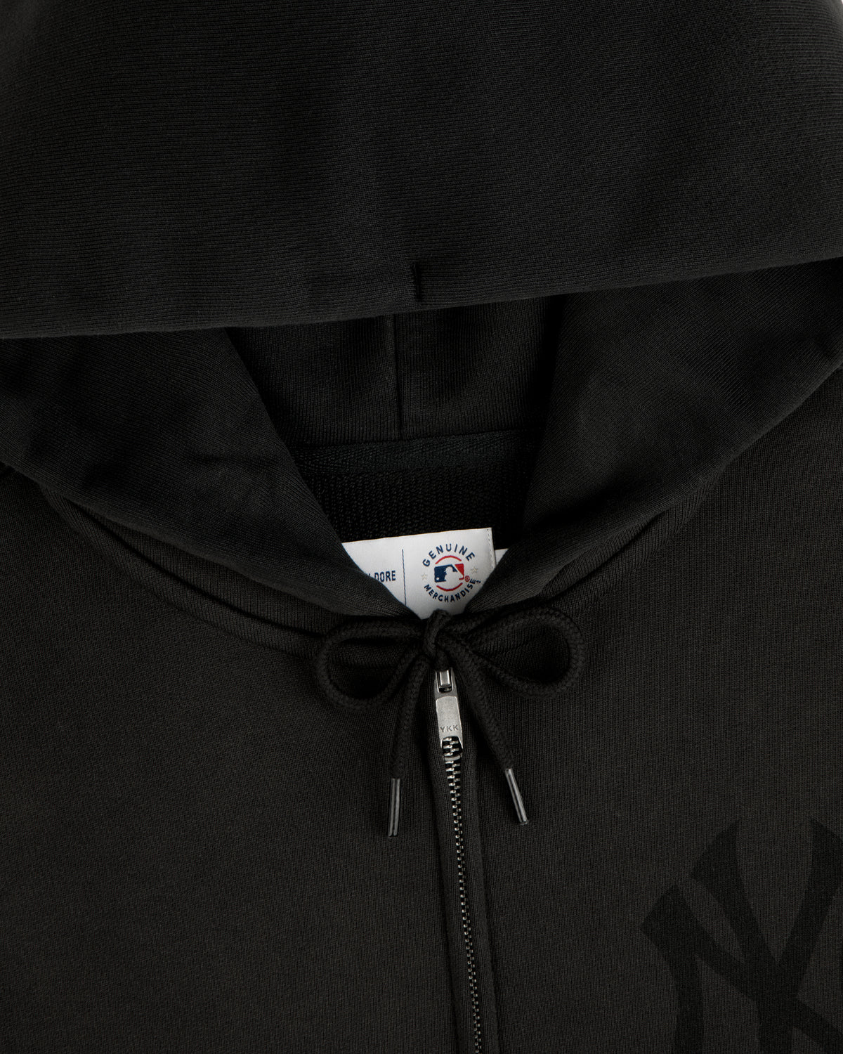 Yankees Washed Full-Zip Hoodie with drawstrings tied in a bow and visible collar tag.