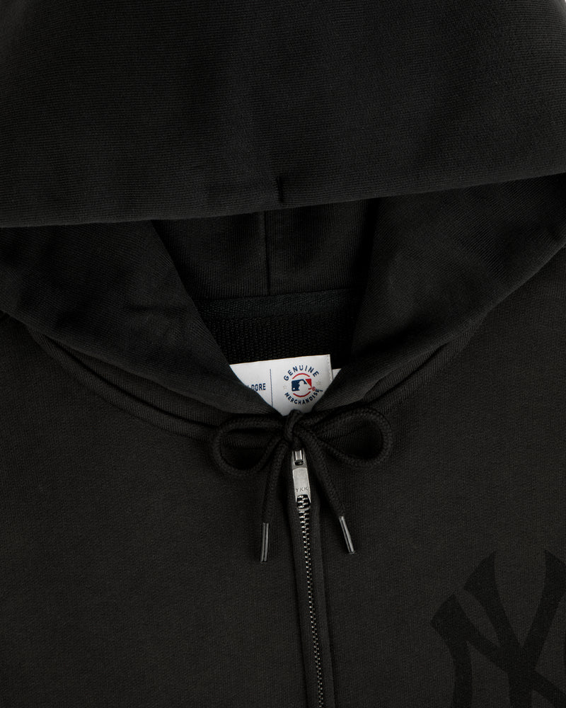 Yankees Washed Full-Zip Hoodie with drawstrings tied in a bow and visible collar tag.