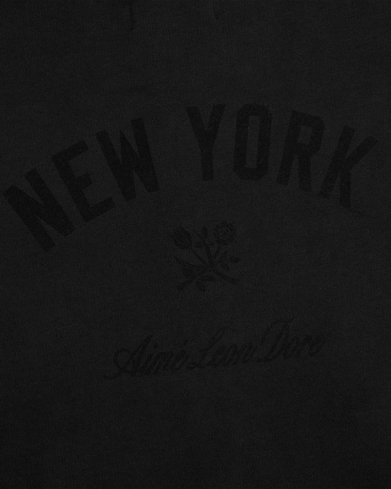 Yankees Washed Full-Zip Hoodie: Black with NEW YORK arched, two roses, and faint Aimé Leon Dore below.