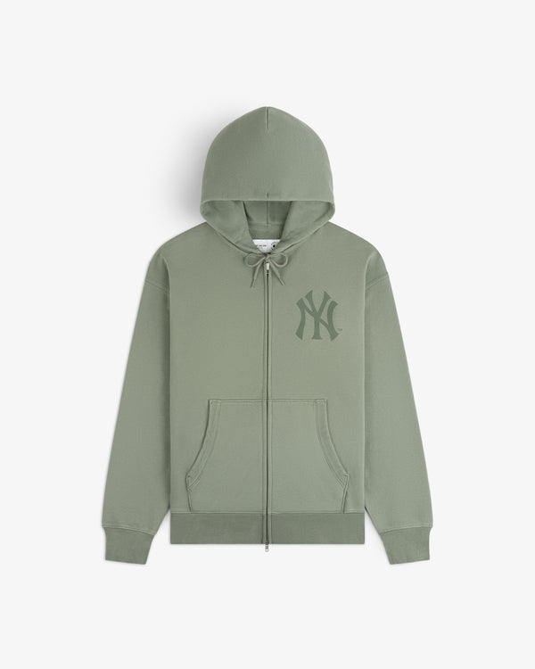 Yankees Washed Full-Zip Hoodie in light green with front pockets and NY Yankees logo on chest, shown flat on white.