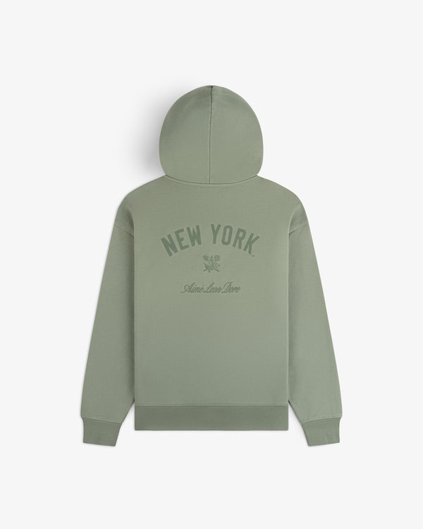 Yankees Washed Full-Zip Hoodie in sage green with NEW YORK and Ami de Coeur print, shown from the back.