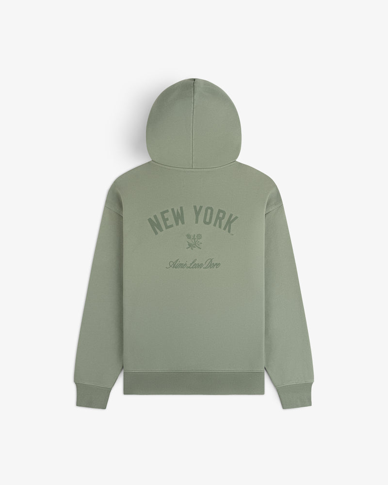 Yankees Washed Full-Zip Hoodie in sage green with NEW YORK and Ami de Coeur print, shown from the back.