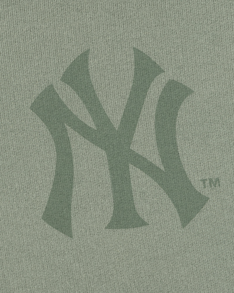 Close-up of the Yankees Washed Full-Zip Hoodie featuring a green New York Yankees logo on the fabric.