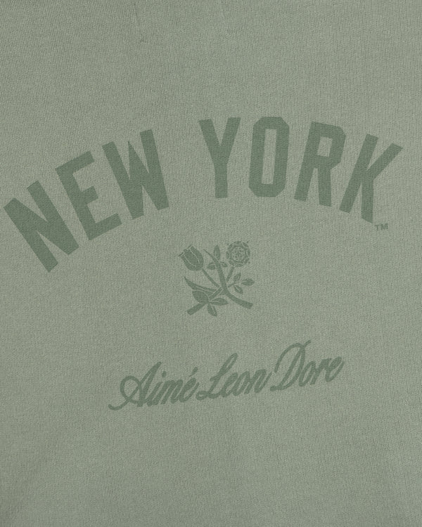 Green Yankees Washed Full-Zip Hoodie with NEW YORK arched above a rose and Aime Leon Dore below the graphic.