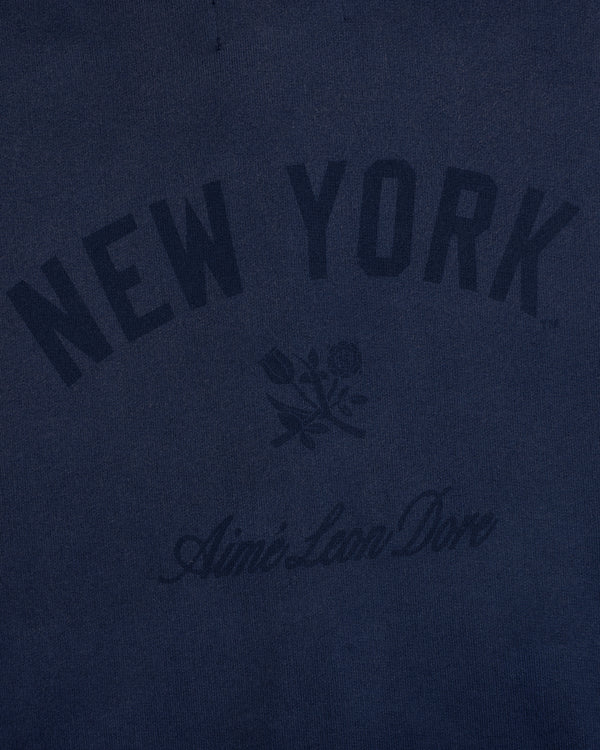 Navy Yankees Washed Full-Zip Hoodie with NEW YORK, rose graphic, and Aimé Leon Dore below.