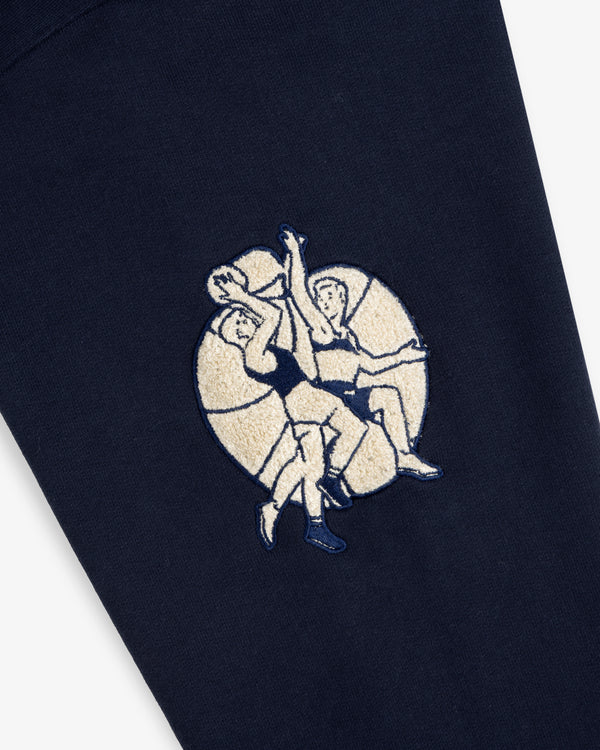 Two athletic figures are embroidered on the Mulberry Letterman Hoodie, set against a circular light background.