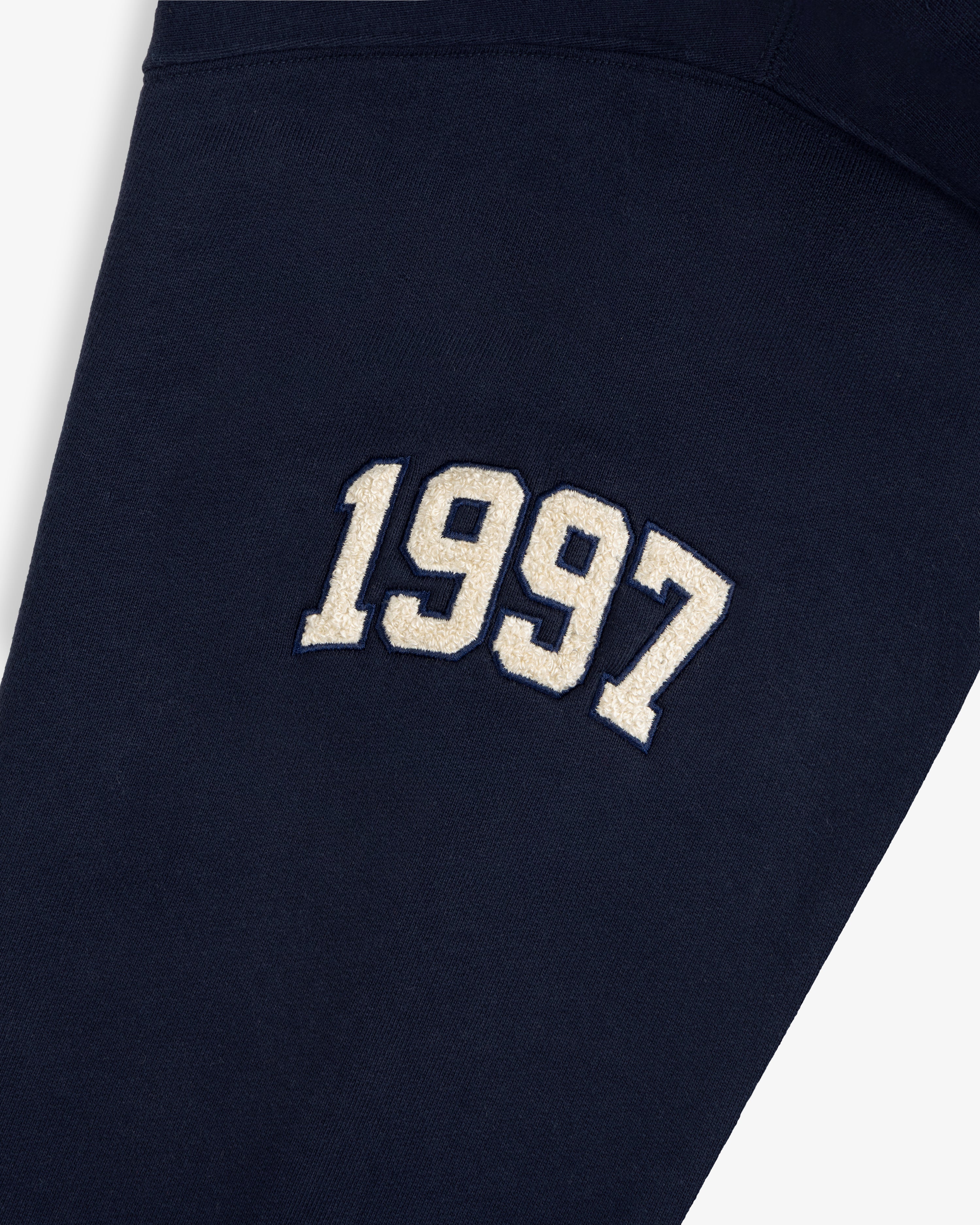 Mulberry Letterman Hoodie in navy with bold white 1997 varsity embroidery on the front.