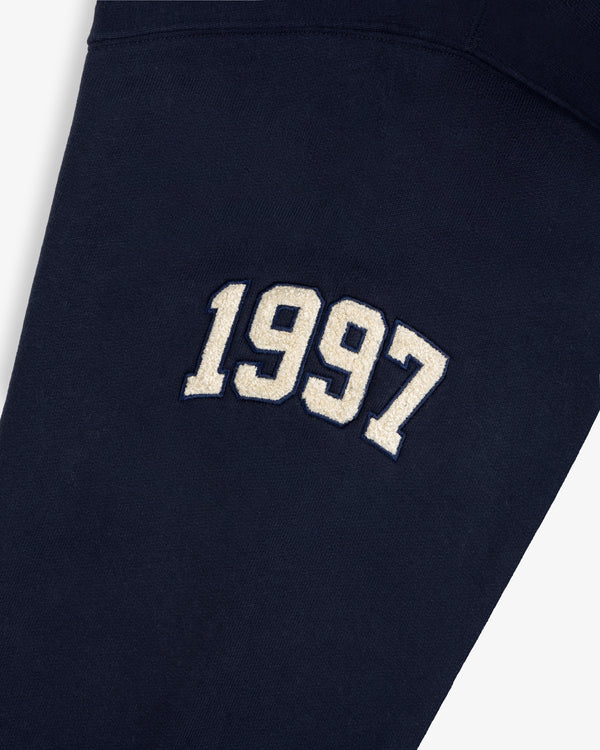 Mulberry Letterman Hoodie in navy with bold white 1997 varsity embroidery on the front.