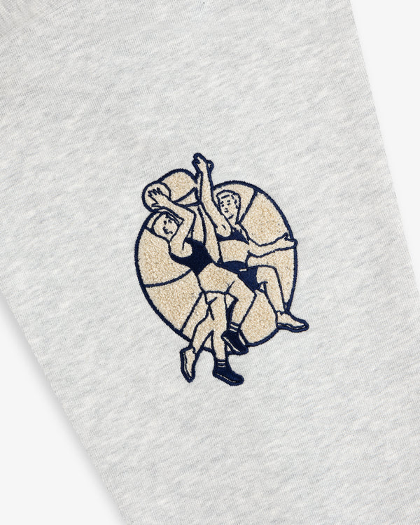 Two cartoon basketball players jump for a ball on a large basketball, printed on gray Mulberry Letterman Hoodie.