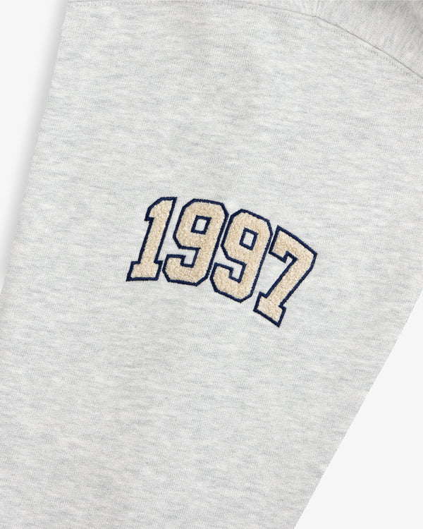 Mulberry Letterman Hoodie in gray with “1997” beige embroidery outlined in black on the fabric.