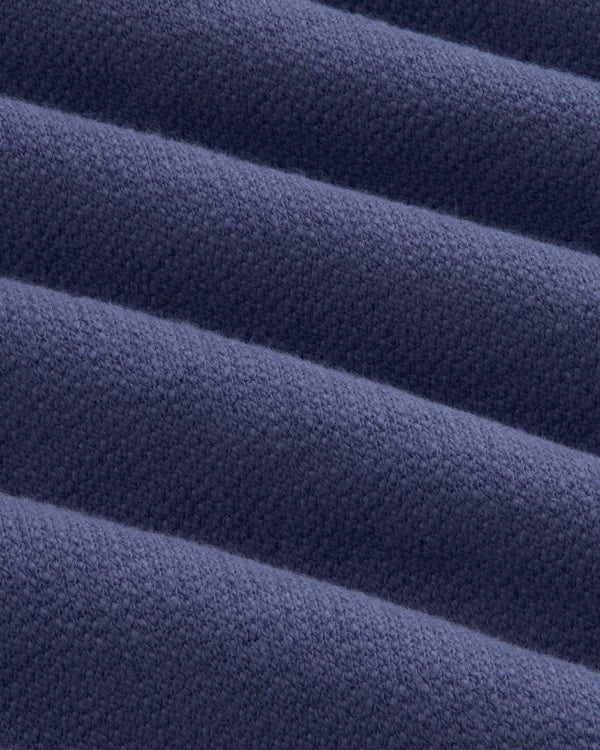 Close-up of soft, navy Stone Washed Marina Hoodie fabric with textured ridges and subtle woven detail.